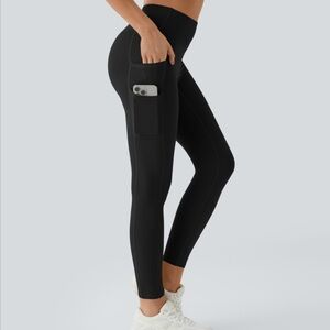 Halara SoftlyZero™ High Waisted Double Pockets Plain Leggings-UPF50+ in black.